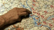 Hitler points at a map, while telling about Steiner's involvement in the plan.