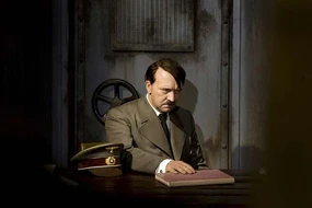 The Berlin Madame Tussaud wax Hitler about to pound the table and shout Fegelein... or not. He also waits to be informed by a wax Gunsche.