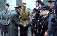 Evidence 1: His uniform has no decorations.