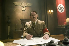 Doctor Who - Let's Kill Hitler Hitler: Like Dolfy, he sits in his office and has a writing tool.