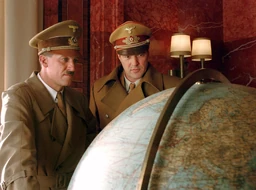 Speer Und Er Hitler, along with his Speer, look at the Earth Globe, on the American side.