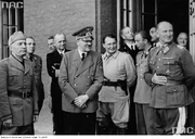 Mussolini (left).