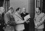 Göring instructs the waiter Fegelein to order five of each and every item in the menu.