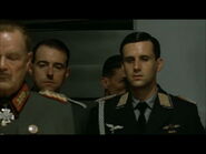 Hitler planning scene Mohnke enters the room behind Nicolaus von Below