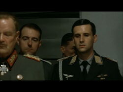 Hitler planning scene Mohnke enters the room behind Nicolaus von Below.jpg