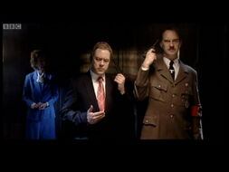 Dead Ringers Hitler about to shoot himself, along with Tony Blair. M. Thatcher is behind.