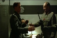 Weidling handing out his firearm at a Fuhrerbunker guard post.