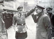 Artur Axmann saluting Hitler.jpg (156 KB) Evidence 4: His uniform has a lot of decorations.