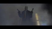 Agent 47 ready to fight amid tear gas in the intro cutscene.