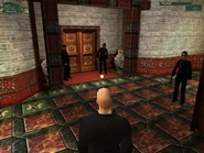 A female Red Dragon bodyguard armed with the Uzi.