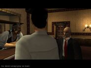 Agent 47 giving advice to Fritz at the casino.