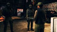 Maya speaking with two Militia Spec Ops soldiers.