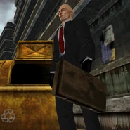 Agent 47 carrying the Sniper Case (note the Hitman insignia).