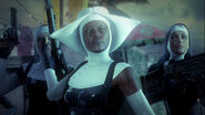 Dixon receiving her RPG in the intro cutscene of the mission "Attack of the Saints".