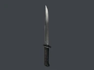 The Combat Knife, a lethal melee weapon featured here in HITMAN 3.