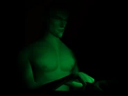Agent 47 using his laptop.