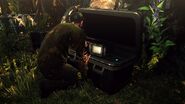 Lawrence inspecting the boxful of monitors.