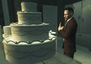 Buddy Muldoon tasting a piece of his wedding cake.