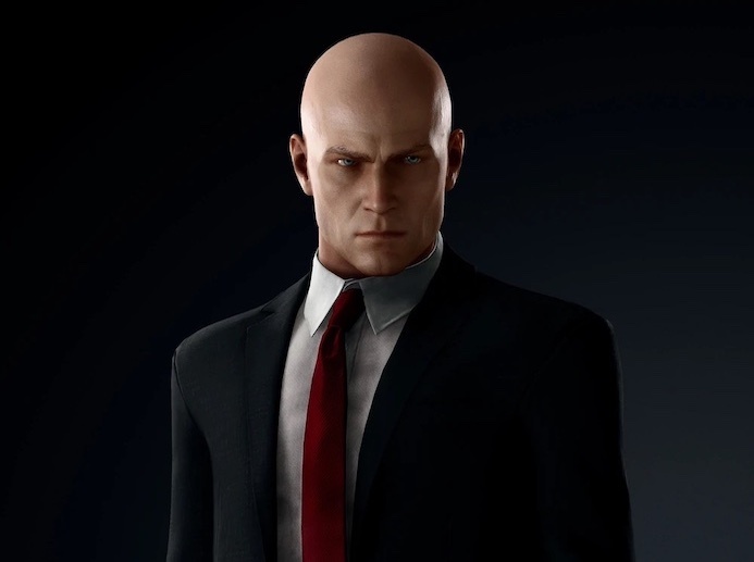 The target is bald wears a suit has a tattoo  rHiTMAN