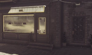 The entrance to the ICA Safe House is to the right of the Il Maiale Pizzicheria.