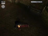 Agent 47 pulls the scarecrow down.