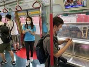 MTR staff distribute MLR postcard to passengers 06-05-2022