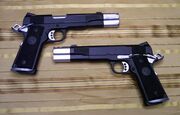 Amanda's Twin Colt M1911 pistols.