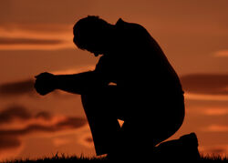 Man-praying-on-one-knee1