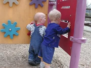 Toddlers exploring a playground.