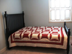 a bed with a quilt on it