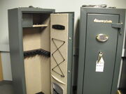 Two gun safes - one open, one closed.