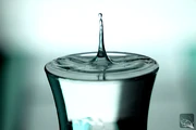 simple - a drop of water hits a full glass