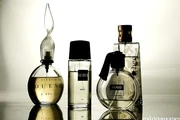 four perfumes in differently shaped bottles