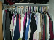 clothes on hangers in the closet