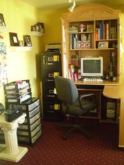 Home office, with organized supplies near a desk.