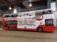 A bus with a full-body advertisement for Routes 90 and 97