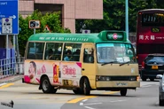 A route 140M minibus is entering Castle Peak Road - Castle Peak Bay