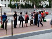 Long queues at en-route stops are common during peak hours due to the low frequency of service