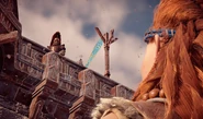Aloy asking the Carja guards to open the gates.[1]