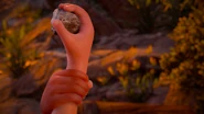 (Drop your rock) Another Nora child stopping Bast from throwing another rock at Aloy.[2]