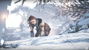 Aloy climbing up the cliff.