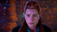 Aloy watching the message left for Olin.