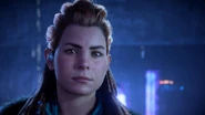 Aloy watching General Herres' presentation.
