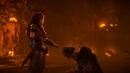 Lansra bowing down to Aloy, while Aloy tells her to stop.