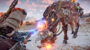 Aloy overriding a Strider.