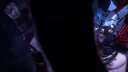 Helis stomping Aloy unconscious.