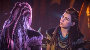 Aloy watching a recording of herself.