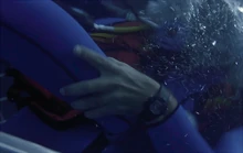 Pierson pins Hootie's legs around his waist.