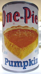 A can of pureed pumpkin, typically used as the main ingredient in pumpkin pie.