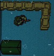 A Soldier wearing a poncho, guarding his outpost.